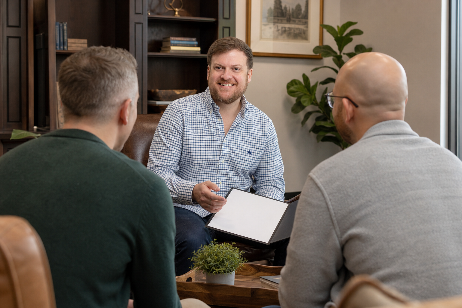 Louisiana LGBTQ estate planning attorney Morgan Field meeting with a same-sex couple